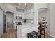 Modern kitchen with white cabinets, quartz countertops, and stainless steel appliances at 19145 Cherry Rose Cir, Lutz, FL 33558