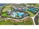 Aerial view of community amenities including pools, tennis courts, and a clubhouse at 1920 Longliner Loop, Wesley Chapel, FL 33543