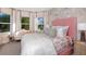 Charming bedroom with pink accents and a window seat at 1920 Longliner Loop, Wesley Chapel, FL 33543