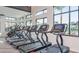 Modern fitness center with multiple treadmills and large windows at 1920 Longliner Loop, Wesley Chapel, FL 33543