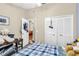 Spacious bedroom with a double bed, built in closet and access to another room at 2188 Elm St # 1107, Dunedin, FL 34698