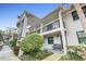 Two-story building with balconies and landscaping at 2188 Elm St # 1107, Dunedin, FL 34698