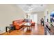 Living room with leather sectional and hardwood floors at 2188 Elm St # 1107, Dunedin, FL 34698