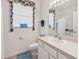 Clean bathroom with single sink vanity, toilet, and shower/tub combo at 2234 Preservation Green Ct, Sun City Center, FL 33573