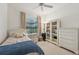 Small bedroom with twin bed and built-in shelving at 2234 Preservation Green Ct, Sun City Center, FL 33573