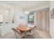 Charming dining room with wood table and chandelier at 2234 Preservation Green Ct, Sun City Center, FL 33573