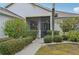 Front entrance with walkway and landscaping at 2234 Preservation Green Ct, Sun City Center, FL 33573