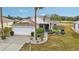 Single-story home with landscaped yard and driveway at 2234 Preservation Green Ct, Sun City Center, FL 33573