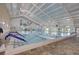 Indoor swimming pool with ample space at 2234 Preservation Green Ct, Sun City Center, FL 33573