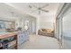 Living room with comfortable seating and access to sunroom at 2234 Preservation Green Ct, Sun City Center, FL 33573