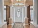 Elegant foyer with columns and a decorative door at 2262 Sagebloom Ter, North Port, FL 34286