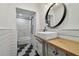 Stylish bathroom with a floating vanity and hexagon tile floor at 2522 Krueger Ln, Tampa, FL 33618