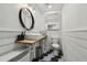 Modern bathroom with hexagon tile floor and floating vanity at 2522 Krueger Ln, Tampa, FL 33618