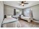 Guest bedroom with twin beds and ceiling fan at 2522 Krueger Ln, Tampa, FL 33618