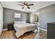 Bright bedroom with a king-size bed, ceiling fan, and hardwood floors at 2522 Krueger Ln, Tampa, FL 33618