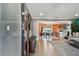 Open concept entryway with wood floors, coat rack, and view of living room and dining area at 2522 Krueger Ln, Tampa, FL 33618