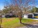 House exterior with a white and gray color scheme and a spacious yard at 2522 Krueger Ln, Tampa, FL 33618