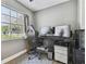 Home office with a large desk, comfortable chair, and two monitors at 2522 Krueger Ln, Tampa, FL 33618