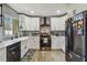 Newly renovated kitchen featuring white shaker cabinets and stainless steel appliances at 2522 Krueger Ln, Tampa, FL 33618