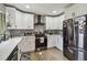 Newly renovated kitchen featuring white shaker cabinets and stainless steel appliances at 2522 Krueger Ln, Tampa, FL 33618