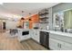 Modern kitchen with white cabinets, island, and an open floor plan at 2522 Krueger Ln, Tampa, FL 33618