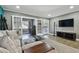 Living room with comfortable seating, a coffee table, and French doors leading to a home office at 2522 Krueger Ln, Tampa, FL 33618