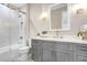 Modern gray bathroom with a walk-in shower and white subway tile at 2623 S Parkview St, Tampa, FL 33629