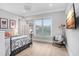 Bedroom with light hardwood floors and a metal framed bed at 2623 S Parkview St, Tampa, FL 33629