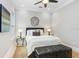 Bright bedroom with a queen bed and light and airy decor at 2623 S Parkview St, Tampa, FL 33629