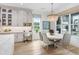 Bright breakfast nook with round table and chairs near kitchen at 2623 S Parkview St, Tampa, FL 33629