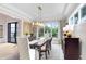 Formal dining room with hardwood floors, a large table, and a stunning chandelier at 2623 S Parkview St, Tampa, FL 33629