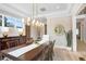 Formal dining room with hardwood floors, a large table, and a stunning chandelier at 2623 S Parkview St, Tampa, FL 33629