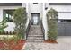 Modern front entrance with brick steps and black metal railings at 2623 S Parkview St, Tampa, FL 33629