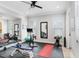 Well-equipped home gym with various exercise machines and mirrors at 2623 S Parkview St, Tampa, FL 33629