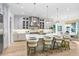 Open concept kitchen with white cabinets and marble countertops at 2623 S Parkview St, Tampa, FL 33629