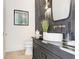 Modern powder room with dark tile, floating vanity, and stylish fixtures at 2623 S Parkview St, Tampa, FL 33629