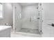 Large walk-in shower with marble tile and glass enclosure at 2623 S Parkview St, Tampa, FL 33629