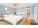 Virtually staged bedroom with light walls and hardwood floors at 2635 Seville Blvd # 109, Clearwater, FL 33764