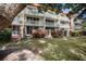 Exterior view of the building, showing the balconies and landscaping at 2635 Seville Blvd # 109, Clearwater, FL 33764