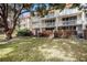 Exterior view of the building, showing the balconies and landscaping at 2635 Seville Blvd # 109, Clearwater, FL 33764