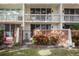 Exterior view of the building, showing the balconies and landscaping at 2635 Seville Blvd # 109, Clearwater, FL 33764