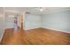 Living room with hardwood floors and view of dining area at 2635 Seville Blvd # 109, Clearwater, FL 33764