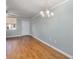 Open living room showcasing hardwood floors at 2635 Seville Blvd # 109, Clearwater, FL 33764