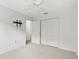 Bedroom featuring neutral carpet, closet with sliding doors, and a view of the hallway at 28643 Seashell Ct, Wesley Chapel, FL 33545