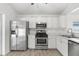 Kitchen featuring stainless steel appliances and ample counter space at 28643 Seashell Ct, Wesley Chapel, FL 33545