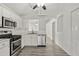 Well-lit kitchen with stainless steel appliances and modern finishes at 28643 Seashell Ct, Wesley Chapel, FL 33545