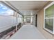 View of the covered patio overlooking the yard with screened enclosure with view of backyard at 28643 Seashell Ct, Wesley Chapel, FL 33545