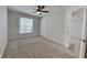 Spacious bedroom with neutral carpeting and ceiling fan at 29325 Birds Eye Dr, Wesley Chapel, FL 33543