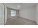 Well-lit bedroom featuring carpet and a window at 29325 Birds Eye Dr, Wesley Chapel, FL 33543