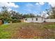 Backyard view of the house, showing ample space at 303 E 120Th Ave, Tampa, FL 33612